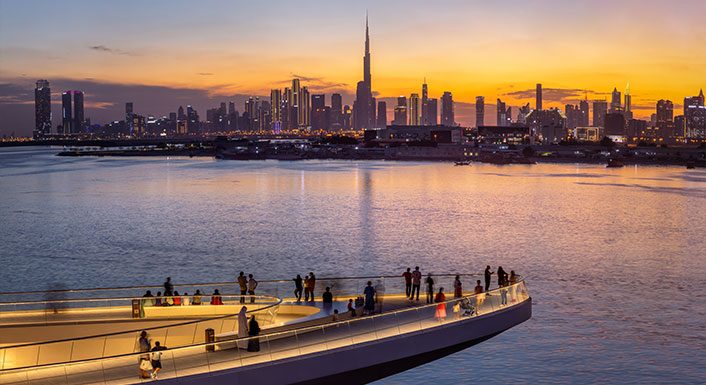 The Viewing Point at Dubai Creek Harbour looking toward the Dubai skyline at sunset